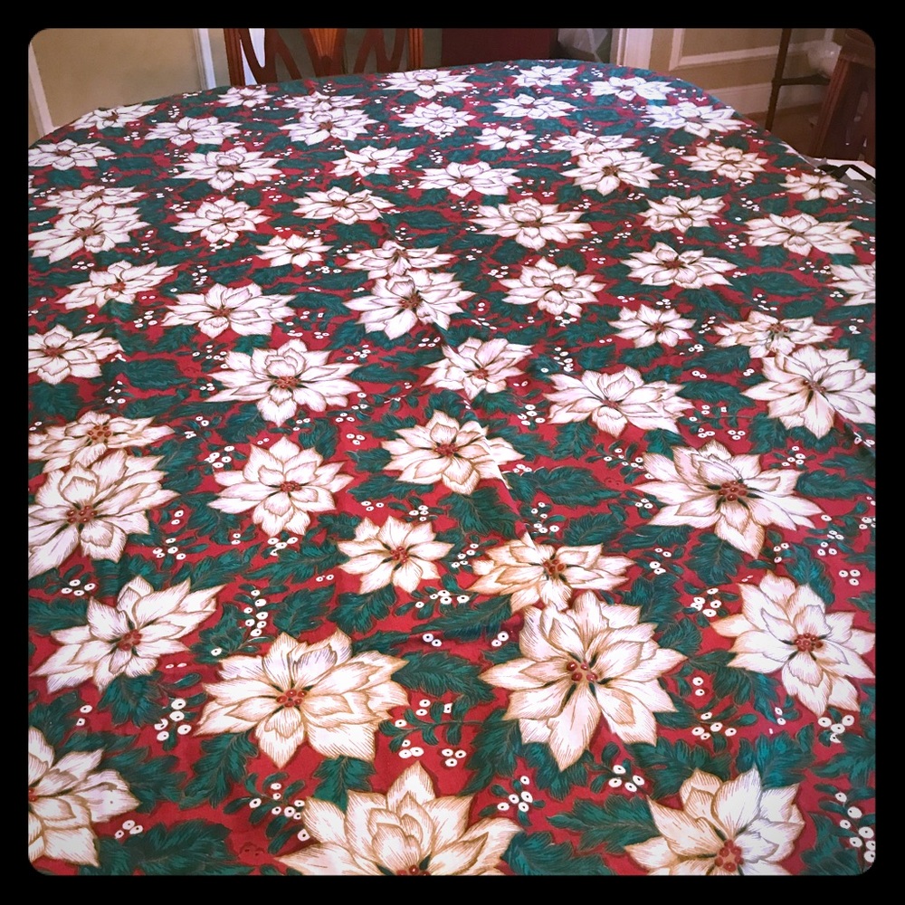 Poinsettia tablecloth 60”x84” scotch guarded